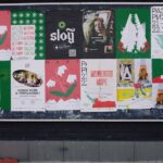 A vibrant urban bulletin board with a variety of colorful posters in Russian. - Photo by ready made on Pexels